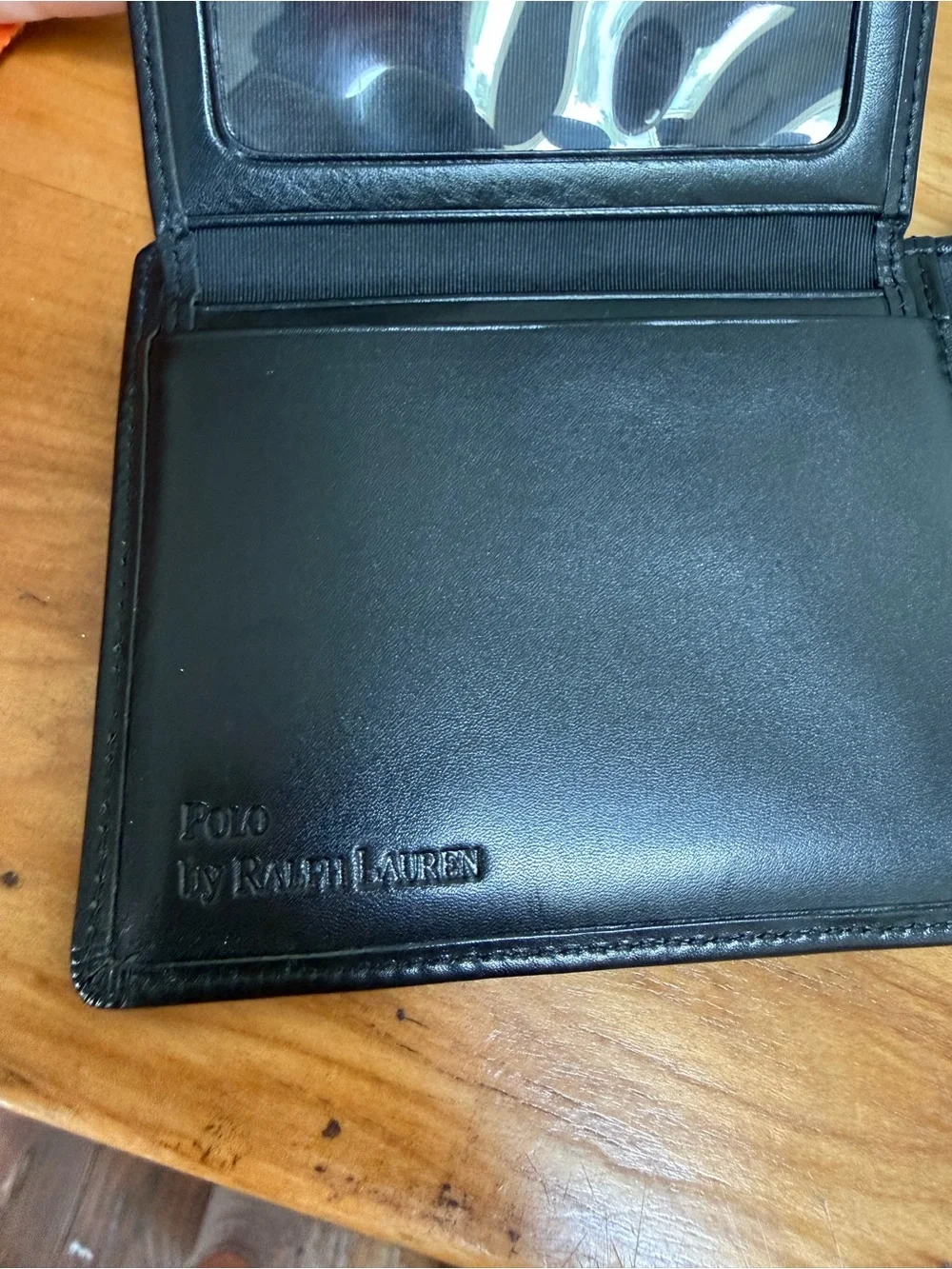 Polo Ralph Lauren bi-fold leather wallet in black featuring a debossed logo